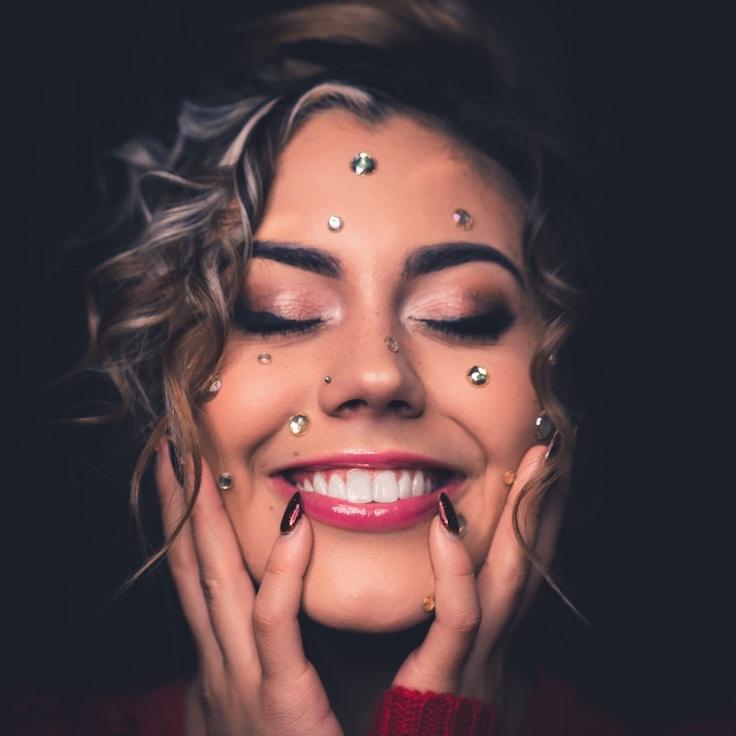 Kaveri Mehta, Lead Design Curator at MeadowsParkPilot, reviewing corporate floral arrangements